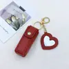 Bolsa de Maquillaje con Espejo en Forma de Corazón de Cuero Llavero Colgante Moda Belleza Fabricante Mayorista Bolsa para Labiales Estuche para Labiales