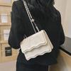Bolso pequeño cuadrado cruzado al hombro estilo Western simple 2024 patrón de ola primavera temprana nuevo casual moda para ir al trabajo estilo coreano para mujer