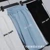 Atacado marca da moda palm angel casal shorts esportivos casuais masculinos e femininos cordão reto elástico calças high street