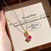 Collar de diamantes Fanta de lujo ligero retro con cierre de corazón de burbuja de gema colorida y colgante de caramelo de corindón rojo, versátil para el trabajo, para mujer