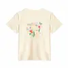 Camiseta blanca de mujer sin hombros, cuello redondo, manga corta, nuevo estilo de verano con diseño de estampado floral, versátil y juvenil