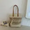 Bolsa Tejida Hueca Estilo Nuevo 2026 Transfronteriza Bolsa de Paja para Vacaciones en la Playa Bolsos de Hombro de Moda de Gran Capacidad para Mujer