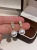 Zhengyuan Shijia Perla Diana Longitud Media Diamante Brillante Aguja Plateada Seiko Aretes Elegantes de Gama Alta Moda Año Nuevo