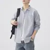 Camisa de manga larga de tela Oxford para hombre, ropa de otoño de alta gama para hombre, chaqueta casual versátil estilo japonés 2026 al por mayor