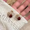 Pendientes de Zirconia Roja con Lazo 2026 Nuevos Pendientes de Clip de Moda Pendientes de Gama Alta Estilo de Nicho Pendientes de Perla