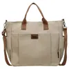 Bolso bandolera retro de lona con múltiples bolsillos para 2026, para el trabajo y los desplazamientos, elegante bolso cruzado informal de color liso