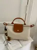 2026 Nuevo Bolso de Hombro Patchwork de Lunares Veraniego Transfronterizo con Estilo y Ambiente Relajado, Bolso de Axila de Viajero de Moda