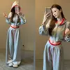 Conjunto de chaqueta corta con capucha y cremallera de manga larga de moda + pantalones anchos de pierna holgada con cordón y bloques de color para influencers de moda rápida