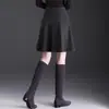 Falda de lana simple y elegante para mujer, nuevo modelo otoño 2026, de cintura alta, adelgazante, reductora de edad, falda de paraguas en línea A