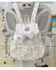 Mochila com cordão de bolinhas e laço, estilo japonês, de alta costura, moderna para meninas, leve e estilosa para sair