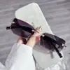 2024 venta al por mayor nueva caja de gafas de sol sin montura de metal moda para mujer trendy AliExpress gafas de venta caliente al por mayor