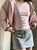 Conjunto de jaqueta moletom curta rosa ombro a ombro e saia para mulheres, novo conjunto esportivo casual estilo coreano para o início do outono