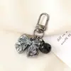 Nuevo Colgante Creativo de Cadena Colgante con Lazo de Perlas para Bolso, Funda de Teléfono, Llavero, Adorno, Exquisito Accesorio de Regalo Pequeño