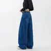 Elegantes jeans azules de pierna ancha y corte curvo para mujer, un diseño nuevo y versátil de moda, con detalles de patchwork, cintura alta y una silueta que estiliza, perfectos para el uso diario.