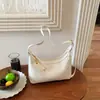 Bolso de axila texturizado transfronterizo para mujer, nuevo modelo 2026, bolso simple de media luna, bolso versátil para hombro y cruzado