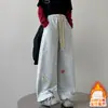 Calça de Moletom Feminina Primavera e Outono 2026 Nova Estilosa Estilo Coreano Crianças Médias e Grandes Casual Floral de Perna Reta Calça de Moletom Transfronteiriça