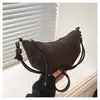 Bolsa feminina de alta qualidade transfronteiriça, com design nichado em formato de croissant, nova bolsa estilo retro bolinho, adequada para saídas, pode ser carregada como bolsa de ombro ou bolsa transversal