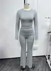 Novo conjunto de outono/inverno europeu e americano, transfronteiriço, sexy, sem costas, gola redonda, caimento justo, com mangas compridas e punhos, calça casual confortável