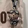 Colgante de Peluche Oso Cámara Creativo Muñeco de Dibujos Animados Muñeco Piloto Regalo de Pareja Llavero Adornos para Colgar en Bolsos