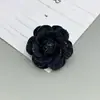 Materiales para accesorios para el cabello hechos a mano estilo coreano camelia de mezclilla semiacabada flores DIY flores de rosa materiales para funda de teléfono
