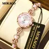 Reloj Marca Mokago Resistente al Agua Simple Elegante Atmósfera Redondo Reloj para Dama Patrón de Sol Lujoso Accesible Reloj con Pulsera