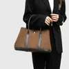 Dropshipping 2025 Estilo Nuevo Lona Elegante Mujer Madura Ropa de Trabajo de Negocios Bolso de Mano para el Jardín Color Contrastante Lujo Accesible Bolso Tote