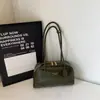 Bolso de hombro para mujer 2026 gran capacidad moderno coreano modelo nuevo de invierno con acabado brillante y diseño simple
