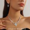 Conjunto de dos piezas de collar y pendientes con cadena de garra exquisita y atractiva para mujer, cadena de clavícula, accesorios para cena