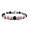Elegante Pulsera de Piedra de Lava Rosa y Negra con Separadores Dorados, presenting una Hermosa Combinación de Piedras Naturales y Audaces Acentos Dorados, Ideal para Ocasiones Casuales y Formales, Ofreciendo un Look Moderno y con Estilo