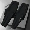 Calças masculinas para primavera e outono, calças casuais da moda com bolsos com zíper, calças esportivas jogger retas largas