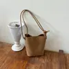 Bolsa de balde com padrão trançado exclusivo para mulheres, novo modelo outono 2026, estilo vintage de alta qualidade, bolsa de ombro única com uma bolsa interna menor