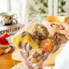 Pan Blanco de Vaca Shuhui Desayuno Panecillos al Vapor Bebé Niños Dibujos Animados Leche Panecillos al Vapor Fideos Congelados Rápidamente Punto de Desayuno Pastel Ding Ding Xing