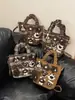Bolsa Balde Infantil Popular de Desenho Animado Fashionável Feminina 2026 Nova Casual Retrô de Alto Valor Ombro Único Transversal