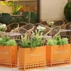 Caja de flores de acero inoxidable para exteriores combinación soporte de flores de hierro departamento de ventas valla de plantación verde partición canaleta para flores cama de flores exterior de restaurante