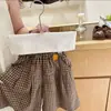 Conjunto de dos piezas para niña de estilo coreano, primavera y otoño, nuevo y moderno, cárdigan de punto calado y pantalones anchos a cuadros, versátil y moderno