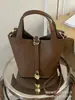 Bolso de mujer 2026 nuevo modelo, bolso de mano casual para el día a día, bolso de hombro y bandolera versátil y a la moda, bolso tipo cubo de nicho texturizado