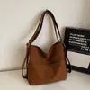 Bolsa Mochila Feminina de Grande Capacidade Nova Coreana Nicho Versátil Ombro Balde Bolsa Estudante Aula Transversal