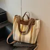 Bolsa tote listrada color block única para mulheres, novo modelo 2026, bolsa de mão para o verão, bolsa de ombro e transversal fashion para o dia a dia.