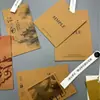 Etiqueta de Papel Kraft para Ropa de Fábrica Original Personalización Etiqueta Hot Stamping Impresión en Color UV Banda Anti-Manipulación Etiqueta Colgante Personalización