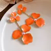 Aretes de flor de perla con goteo de aceite de aguja de acero, aretes dulces exagerados exquisitos estilo europeo y americano, aretes de moda de lujo ligero de alta gama para mujer