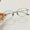 Óculos cat-eye quadrado-redondo de titânio ultraleve, oval azul liso bloqueador de luz azul, armação de arame dourado e prateado, pode ser equipado com lentes de prescrição, armação de óculos masculina de Danyang