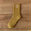 Calcetines de otoño e invierno para mujer de media pantorrilla estilo ins modernos con forro polar gruesos cálidos color liso jacquard japonés cara sonriente calcetines de rizo