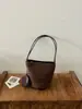 Bolso de cubo de moda para otoño para mujer, bolso de hombro de nicho de moda estilo coreano, bolso de mano vintage de gamuza para el día a día