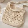 Bolso de mano tejido hueco, nuevo bolso de hombro simple, versátil y elegante, bolso de playa estilo vacacional, bolso de mano de moda para mujer