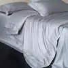 Juego de ropa de cama ultra suave de encaje de color liso de alta gama estilo minimalista italiano, juego de textiles para el hogar de cuatro piezas de algodón Tencel, Kelly