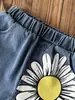 Conjunto de Tres Piezas para Niñas Primavera/Verano 2026 Europeo y Americano Transfronterizo: Blusa Hueca de Color Sólido + Camisola + Jeans con Estampado de Girasol