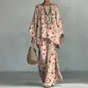 Nuevo conjunto de dos piezas para mujer: camiseta casual de moda con estampado transfronterizo, cuello redondo, manga larga + pantalones de campana