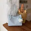 Bolsa feminina de grande capacidade para uso transfronteiriço, nova coleção outono 2026, bolsa de ombro versátil e elegante, bolsa tote moderna e casual para o trabalho e uso diário