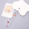 Corrente de Pérola Estilo Chanel para Celular Pingente de Flor Pequena Cordão para Celular Capa de Celular Acessório com Contas Corrente Anti-Queda para Mulheres