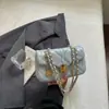 Cadena en forma de diamante de lujo ligero de textura, bolso pequeño cuadrado de un solo hombro para mujer, nuevo de verano 2026, versátil, nicho, moderno, para el trabajo, bandolera